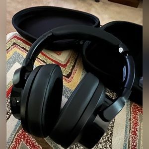 Mixcder over ear noise cancelling wireless headphones.